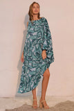 Woman wearing a green leaf-patterned dress against a white wall