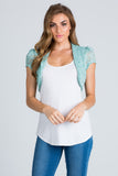 Crochet lace cropped shrug with open front and cap sleeves.
