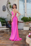 Woman wearing the elegant Juliet JT2698A long prom dress—a pink strapless satin gown with a fitted corset bodice and flared skirt standing on a patio with plants and furniture.