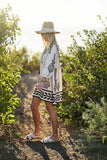 Printed 3/4 Sleeve Dress With Tassel Tie And Fringe Detail On Hem - Rosa Apparel