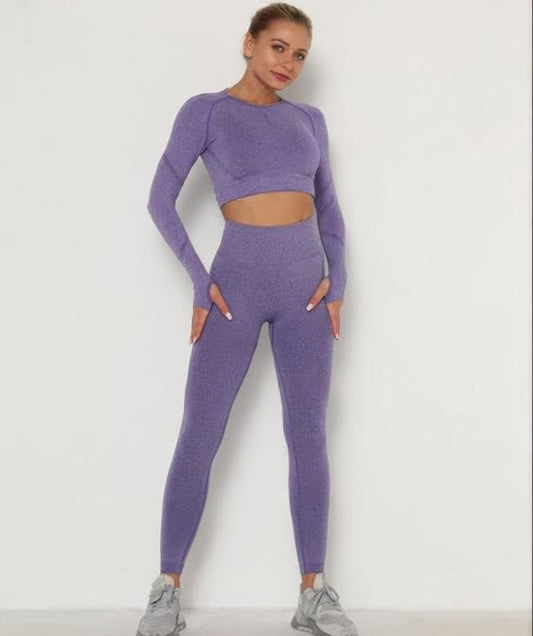 Person wearing a purple athletic outfit on a white background