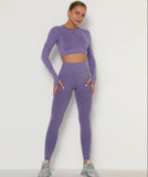 Person wearing a purple athletic outfit on a white background