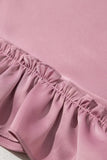 Close-up of pink fabric with ruffled edge on a pink background
