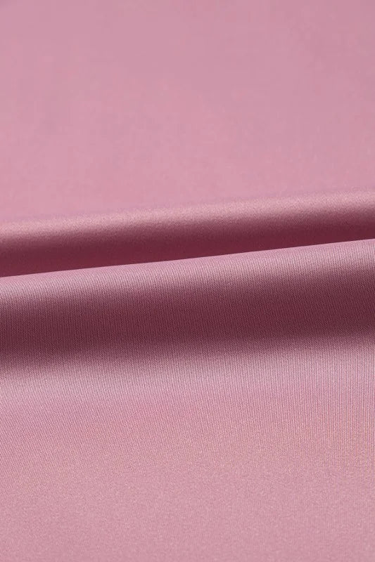 Close-up of pink fabric with a subtle texture