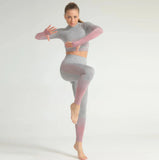 Woman wearing a gray and pink gradient outfit on a white background